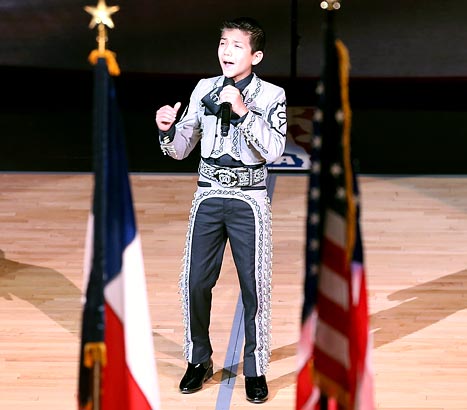 Sebastien De La Cruz, age 11, was the victim of racist tweets after he sang the United States national anthem before Game 3 of the 2013 NBA Finals at the AT&T Center on June 11, 2013 in San Antonio, Texas. Credit: Christian Petersen/Getty Images